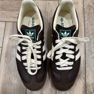 Adidas dark brown Sambas.